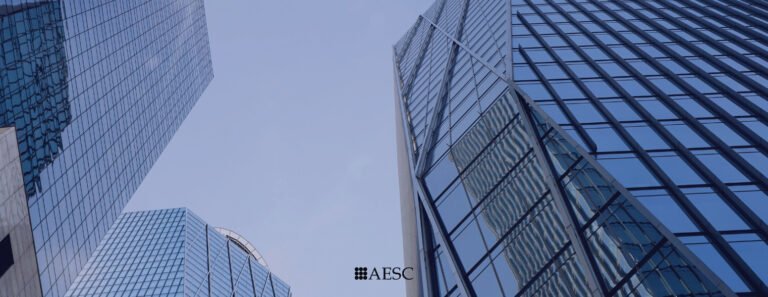 Modern skyscrapers with glass facades in a city skyline.