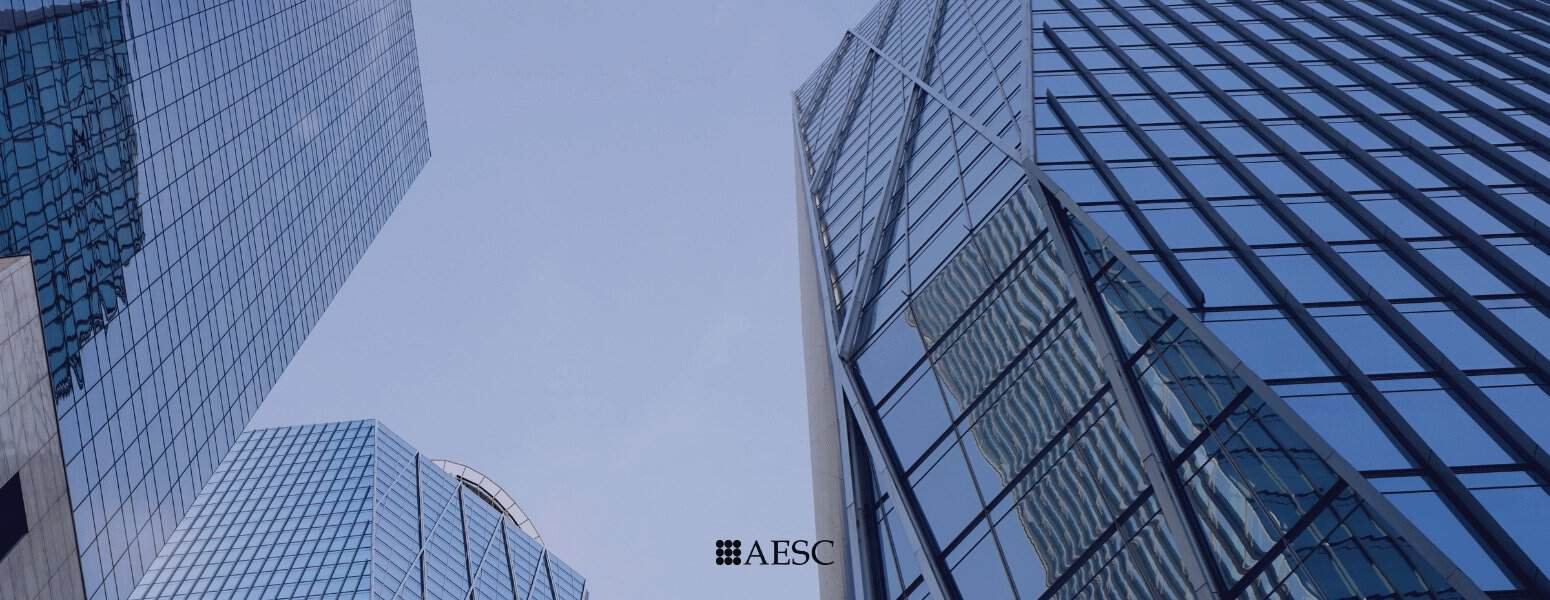 Modern skyscrapers with glass facades in a city skyline.