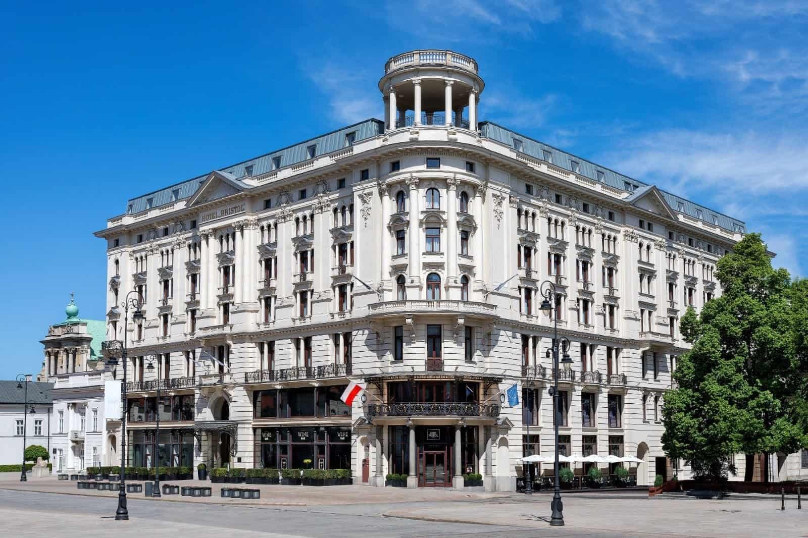 Historic hotel building in a city with clear blue sky.