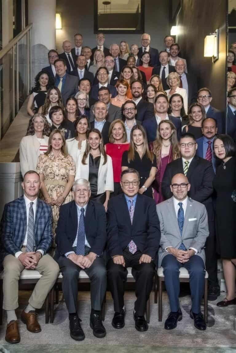 Large group of diverse professionals at Cornerstone Hospitality event.